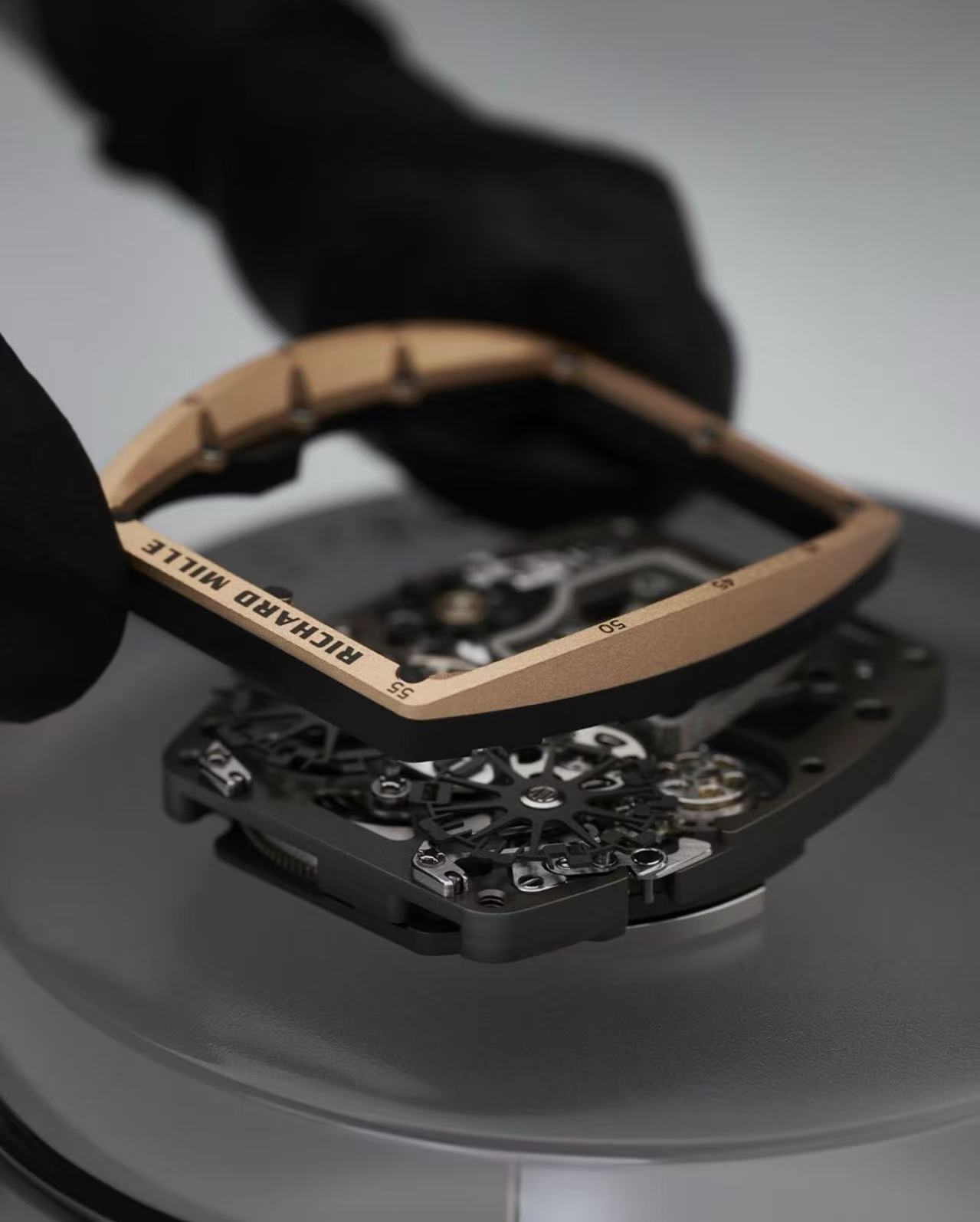 Skilled technician assembling Richard Mille replica watch movement at factory